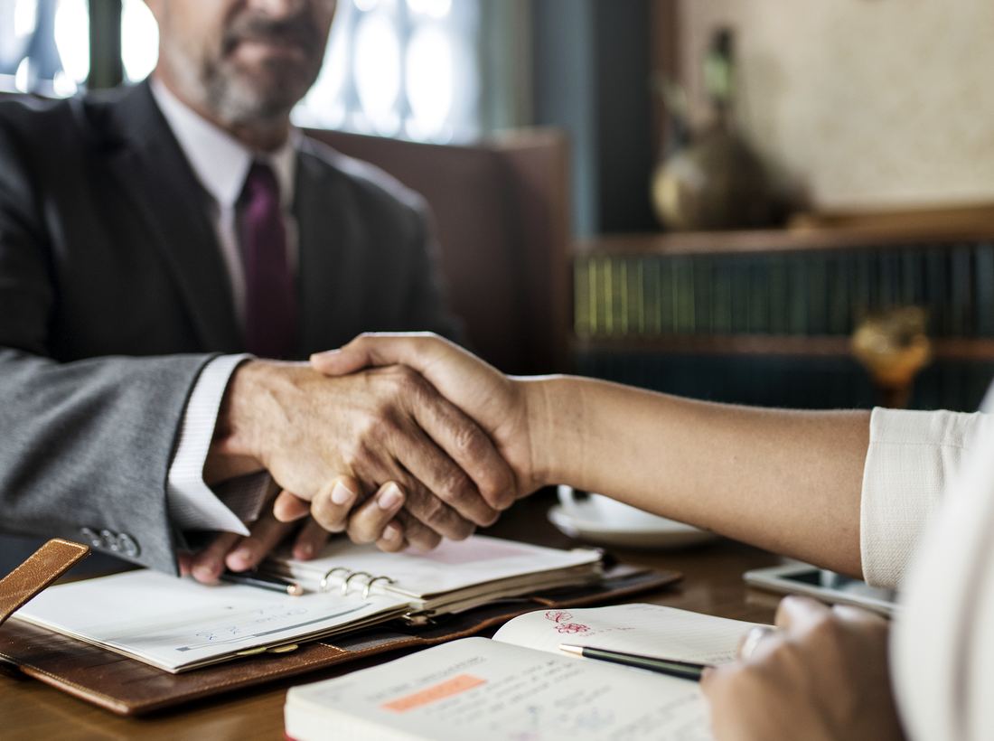 Attorney meeting with a client at the firm